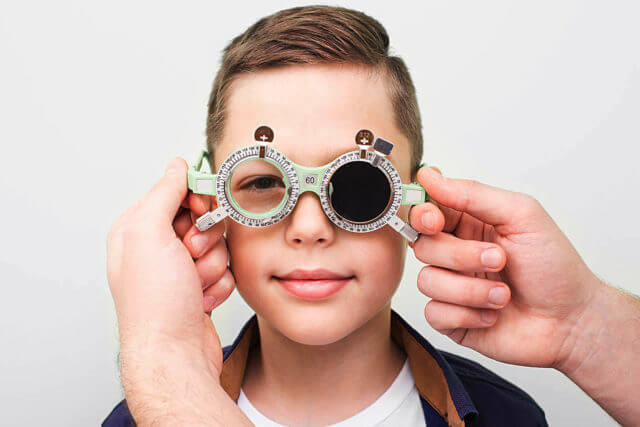 Optometrist Putting On The Boy_1280x853 2 640x427